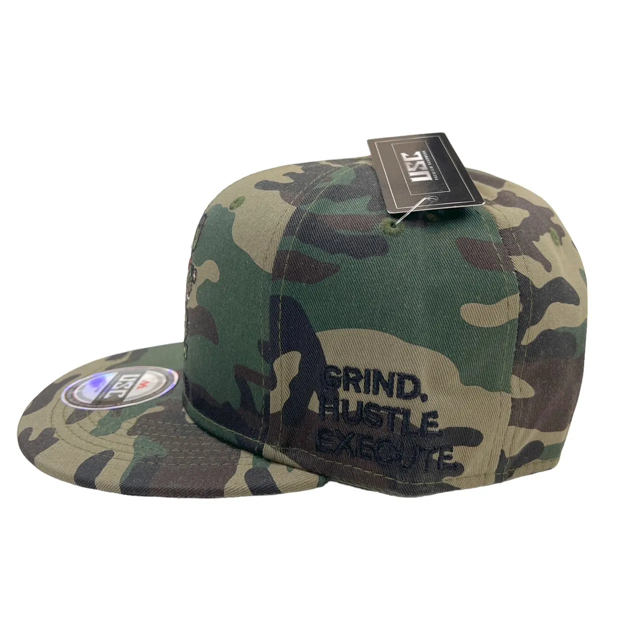 US Cotton Grind Hustle Execute Snapback Hat (Wood Camo) / 2 for $15